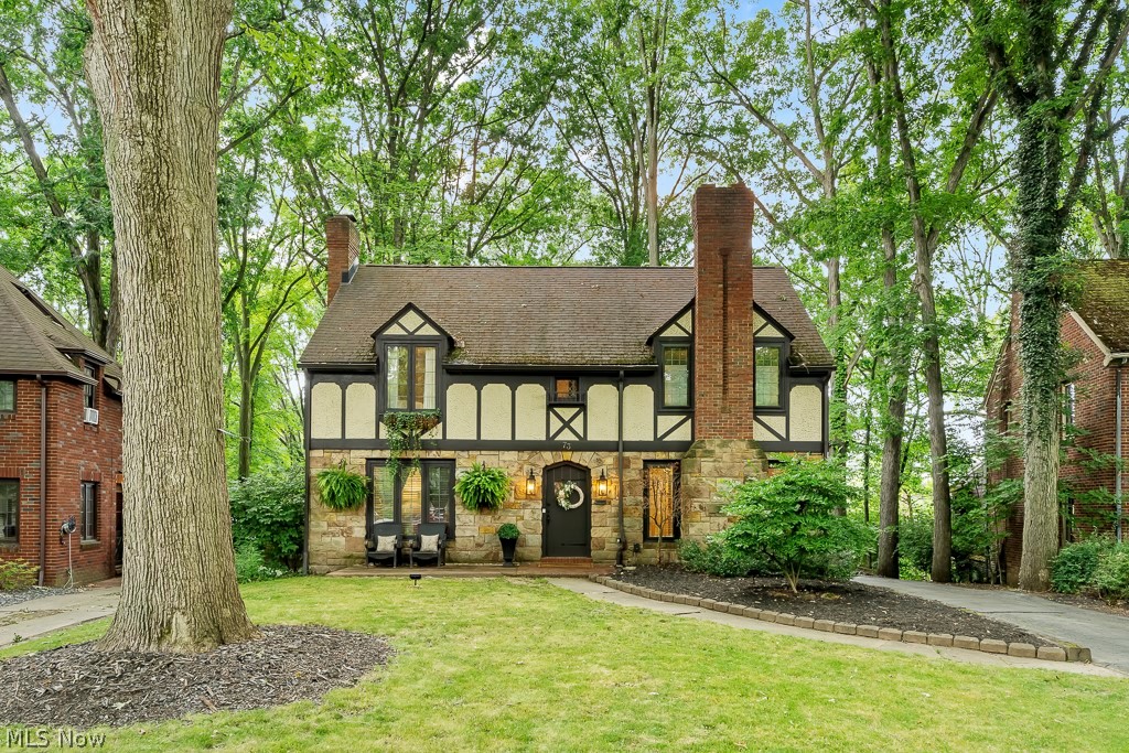 Welcome to this stunning Tudor-style home nestled in the heart of Boardman's historic district. This home exudes timeless elegance and modern upgrades, making it a perfect blend of old-world charm and contemporary comfort. The entire house has been freshly repainted, and natural hardwood floors flow throughout, adding warmth and elegance. The first floor features an inviting office with a bay window, a spacious living room, and a dining room, both adorned with new chandeliers installed in 2024. The kitchen is a chef's delight, with new paint, a stylish backsplash, a modern faucet and sink added in 2024, and sleek formica countertops from 2023! It also comes equipped with brand new appliances, making it ready for your culinary creations. In the basement, you'll find newly installed laminate flooring from 2022, a full bathroom, and convenient access to the attached garage. The laundry area is also located in the basement, adding to the home's practicality. The second floor boasts a beautiful catwalk with natural hardwood floors, leading to three generously sized bedrooms. The master bedroom includes a half bathroom, while a full bathroom serves the other bedrooms. The attic is partially finished, offering a great bonus room for your needs. The exterior of the home is equally impressive, with updated landscaping, sconces, and lighting completed in 2022, enhancing the home's curb appeal. Don't miss the opportunity to own this stunning Tudor home that perfectly blends historic charm with modern updates. Schedule your viewing today before it's too late!