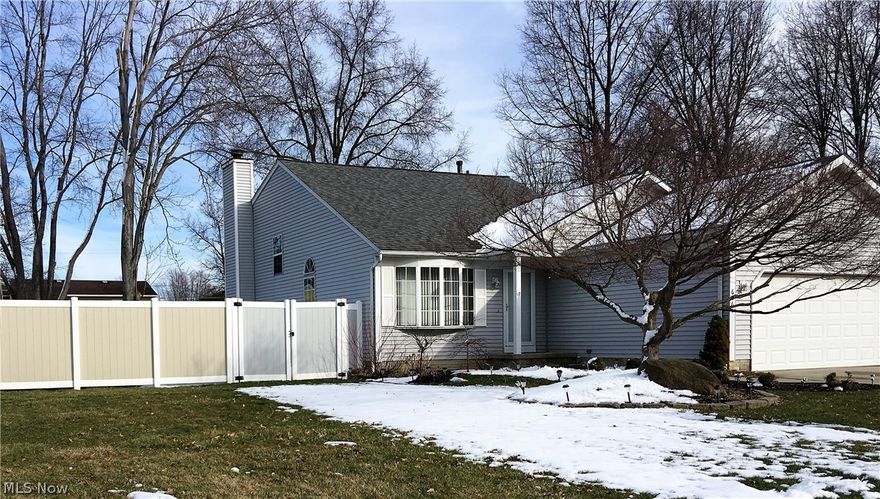 WOW, she's a real beauty and a rare find.  This lovely home is a split level with partial basement (4 levels)and attached 2 car garage.  Vinyl sided with attractive landscaping and vinyl privacy fence.  The moment you walk in you could think this is the "one".  Nice great room opens up to dining room and kitchen with vaulted ceilings.  Kitchen showcases hardwood floors that flow into the dining room.  Main bath up has been some improvements.  You'll find plenty of time to spend in special featured sun room/3 season room has nature stone floor and gas burning.  Family room downstairs has ample space for entertaining and a beautiful stone front fireplace.  Additional bedroom and full bath downstairs as well.  Then welcome yourself to the partially finished basement with custom glass block bar and granite counter top and extra cabinetry.  Backyard offers a shed and full privacy vinyl fenced yard.