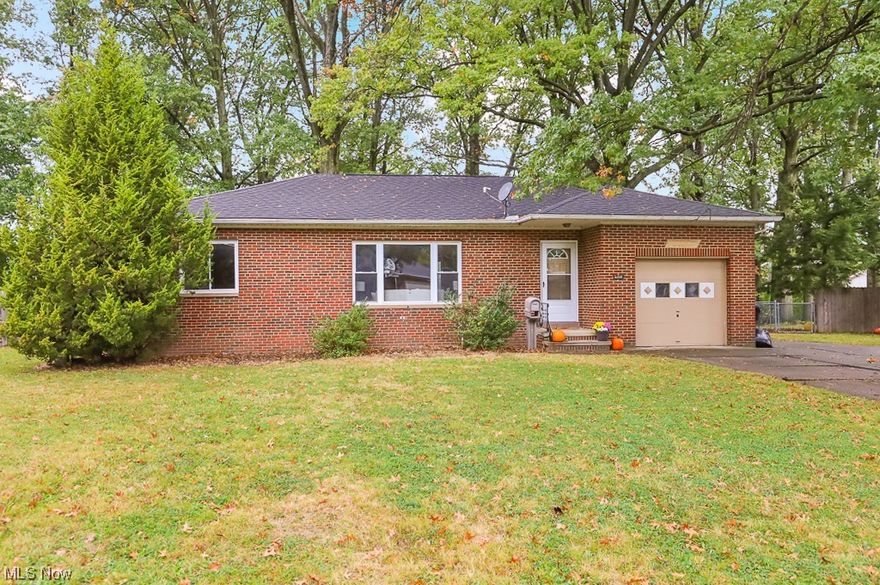 Make this charming brick ranch your new home!  You will be pleasantly surprised by the generous amount of space offered in this two bedroom home (1166 sqft!).  Enter the spacious living room with tons of natural light and beautiful hardwood floors!  The living room is open to the dining room and kitchen!  The main floor also features a newly renovated bathroom and two bedrooms.  Basement is partially finished, clean and dry! Huge fenced in backyard with patio!  One car attached garage with driveway extension next to the garage for additional parking.  Conveniently located near the Brook Park recreation center and I-71 access!