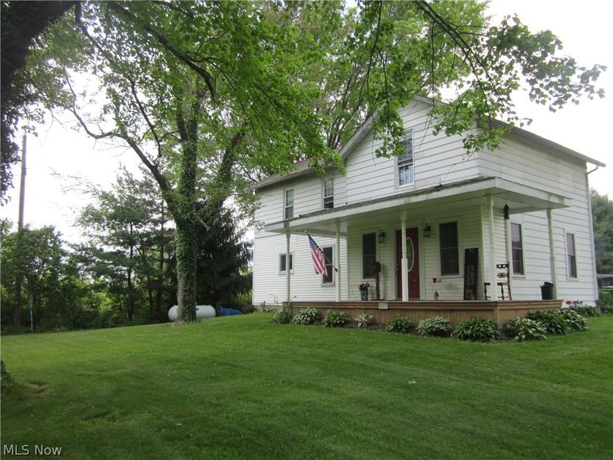 Wonderful 3-4 Bedroom home on one acre.  Great location in Western Reserve Schools and across the road is West Branch District. Near Berlin Lake with a nice country setting. Living room, family room, dining room, bedroom or office, laundry area and full bath on the first floor.  Three more bedrooms and full bath on second floor with another open space for office, playroom, etc.  Over-sized 2 car attached garage! Amazing front porch to enjoy and extra large porch off the back of garage that could once again be screened in. Newer windows, updated kitchen and roof over garage and family room is about 10 years old. Wood burner can stay. One year Home Warranty option.