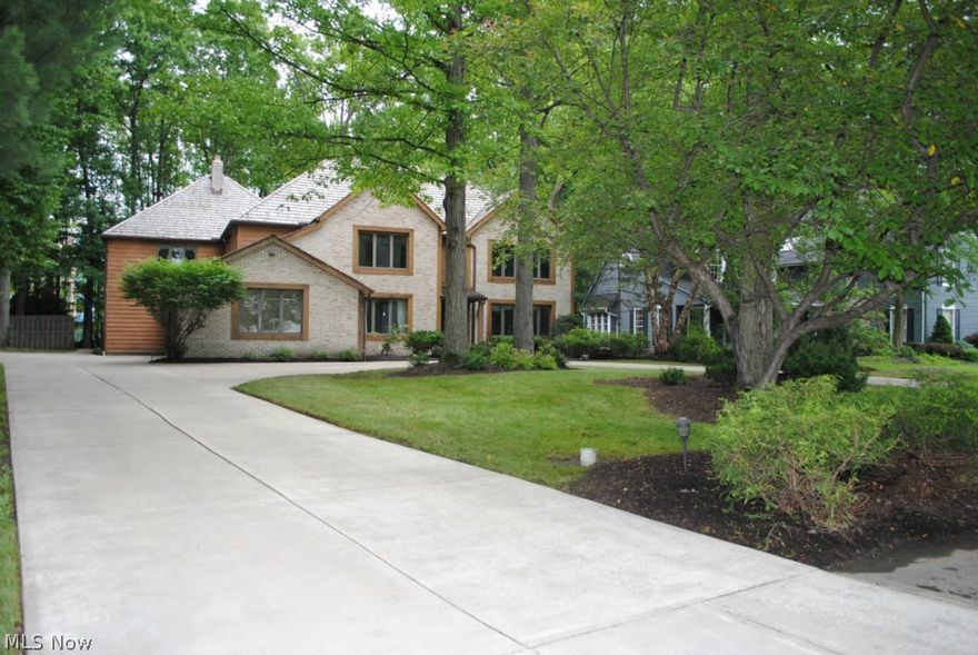 Massive Brick And Cedar Colonial On Beautiful Wooded Lot .... Note Room Sizes .... 1st Floor Guest Suites .... 2 Wood Burning Fireplaces (One In Master Bedroom) .... Dramatic 2 Story Foyer .... 2nd Office Or Lounge In Master Bedroom .... 5 Huge Bedrooms ....  5 Full Baths Plus One Half Bath .... 3 Car Side Load Attached Garage .... Newer Concrete Drive With Valet Loop .... Some New Carpeting ....