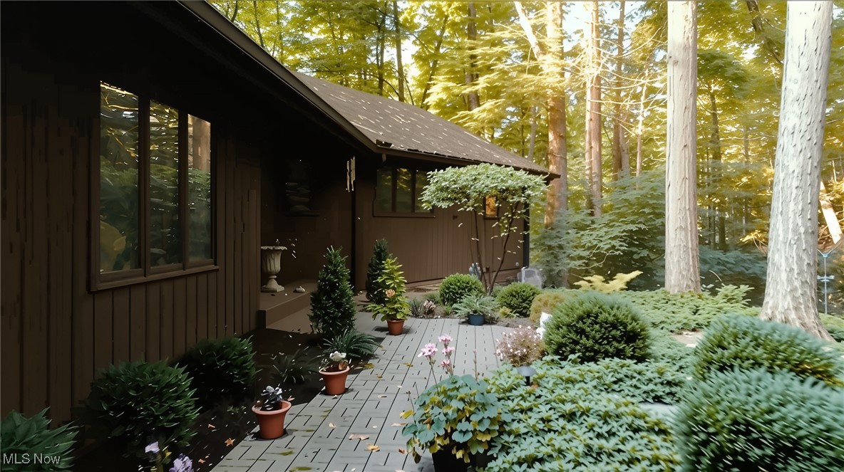If Colorado had a vacation home in Ohio, it would be right here on Hillbrook Lane North. Tucked on just over 5 acres along the storybook Griswold Creek (a tributary of the Chagrin River) nature is your full time backdrop. Watch deer, heron, and fox from your expansive deck or screened porch below with the sound of the water as your soundtrack. While the outside is pure nature-lovers paradise, inside the ranch layout offers over 6,000 finished square feet, including a fully finished walkout lower level and complete in-law suite. Vaulted ceilings soar in the great room and crown one of the home’s most striking features: a suspended, open-sided fireplace that serves as both art and a gathering place. Anchored in stone and surrounded by walls of glass, it frames views of the deck, towering trees, and the creek beyond — making it as much a conversation piece as it is a cozy spot to linger on cool evenings. The primary suite wakes up to water views, and a brand-new roof (2025) means your next chapter starts worry-free. Main-level wrap around deck? Check. Screened porch for lazy summer nights? Double check. This home offers the kind of solid construction and thoughtful layout that’s increasingly rare and this home has been cared for with pride. Its rock-solid bones mean you can live comfortably while deciding how to make it yours. Love it as-is for its retro charm, or bring your own vision for a modern transformation to match the million-dollar estates surrounding it. Perfect location in the Chagrin Valley, this is a one-of-a-kind setting you won’t find again.