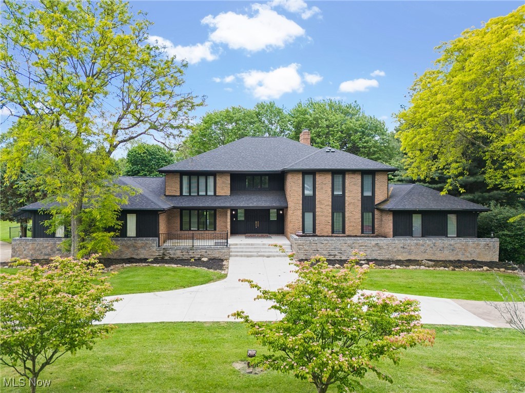 If you have ever been in Stark County you know this house. This amazing 7-bedroom 6 bath house features over 8,000 square foot of living space. This compound sits on an amazing 5.5 acres and the current owner fenced in a couple acres for your furry friends! I don't even know where to start describing this house. Let's do top to bottom! The upper-level features 3 large bedrooms. One bedroom has its own full bath on suite. The other two bedrooms will share the full Jack and Jill. It also features a large loft area overlooking the main floor. As you walk down the spiral staircase you come to the main floor. Main floor features the primary bedroom with fireplace, his/hers walk in closets and its own private balcony. This floor features yet another look that can be used as an office or bedroom. One main feature is the living room it offers a double-sided fireplace with sunken seating area. Large formal dining room, eat in dining area and laundry with 2 half baths round out the main floor. Now the lower level! The current owner actually built 2 bedrooms on the lower level. Not only that but it has a full kitchen, two separate living areas, a full bath ad work out area. The best is still all the storage space this house offers! The current owner installed new carpet throughout, fenced in a portion of the back yard for your furry friends and added 2 more bedrooms! New patio and retaining wall in July of 2024 along with the the deck and home exterior painted.
