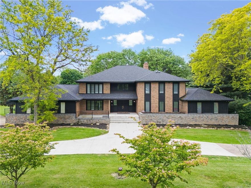 If you have ever been in Stark County you know this house.  This amazing 7-bedroom 6 bath house features over 8,000 square foot of living space.  This compound sits on an amazing 5.5 acres and the current owner fenced in a couple acres for your furry friends!   I don't even know where to start describing this house.  Let's do top to bottom!  The upper-level features 3 large bedrooms.  One bedroom has its own full bath on suite.  The other two bedrooms will share the full Jack and Jill.  It also features a large loft area overlooking the main floor.  As you walk down the spiral staircase you come to the main floor.  Main floor features the primary bedroom with fireplace, his/hers walk in closets and its own private balcony.  This floor features yet another look that can be used as an office or bedroom.  One main feature is the living room it offers a double-sided fireplace with sunken seating area.  Large formal dining room, eat in dining area and laundry with 2 half baths round out the main floor.  Now the lower level!  The current owner actually built 2 bedrooms on the lower level.  Not only that but it has a full kitchen, two separate living areas, a full bath ad work out area.  The best is still all the storage space this house offers!  The current owner installed new carpet throughout, fenced in a portion of the back yard for your furry friends and added 2 more bedrooms!  New patio and retaining wall in July of 2024 along with the the deck and home exterior painted.