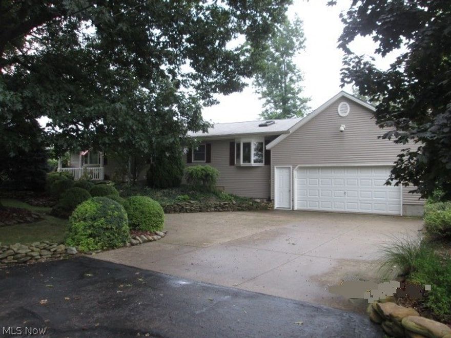 Spacious open and updated Ranch. Large kitchen with dining area. Lots of Cabinets and lighting. Pull our shelves, skylight and moveable island. Appliances and laundry room. Walk out to covered patio. Family room has a skylight, bay window and bar for entertaining. Attached garage will fit 4 cars and has Nature stone flooring and 220v electric. Outside there is a extra paved driveway for additional parking and a 10'x40' cement pad for your RV or boat. the yard has been designed with path, sitting areas landscaping and water feature.