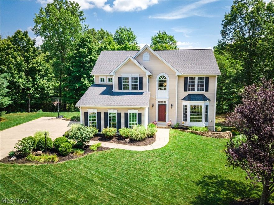 Looking for privacy and a place to relax?  This amazing home is located at the end of a quiet road on a property framed by the woods.The beautiful dark wood floors throughout the first floor that were installed in 2017 lead to the spacious kitchen and morning room. Gorgeous Cambria countertops and Ant cabinets makebunda meal prep a pleasure along with a new range, built-in microwave, and dishwasher that were recently added. Notable features include fresh neutral paint,  a stacked stone fireplace in the window-filled living room with an attached office, a dining room with bay window and inset lighting in the crown molding, a half bath, and first-floor laundry. Upstairs has all new carpet, a master bedroom has an additional seating area and a 12X 7 walk-in closet.  The three other bedrooms offer plenty of storage.  The morning room view is fantastic!  Step outside onto the new Azek fully wrapped deck with no maintenance railings and new steps down to the lower level. Grill, relax, or go for a swim and a rest in the sun by the pool deck.  It's all conveniently built around the walkout basement where you can set up your exercise area or watch the latest on TV. There is also a large wet-bar with cabinets to make serving easy.  Explore the woods over the little creek bridge and have a seat at the firepit or find the hidden treehouse! A new furnace was installed in 2019.  This neutral, beautiful move-in ready home is calling you so you better hurry before it's gone!