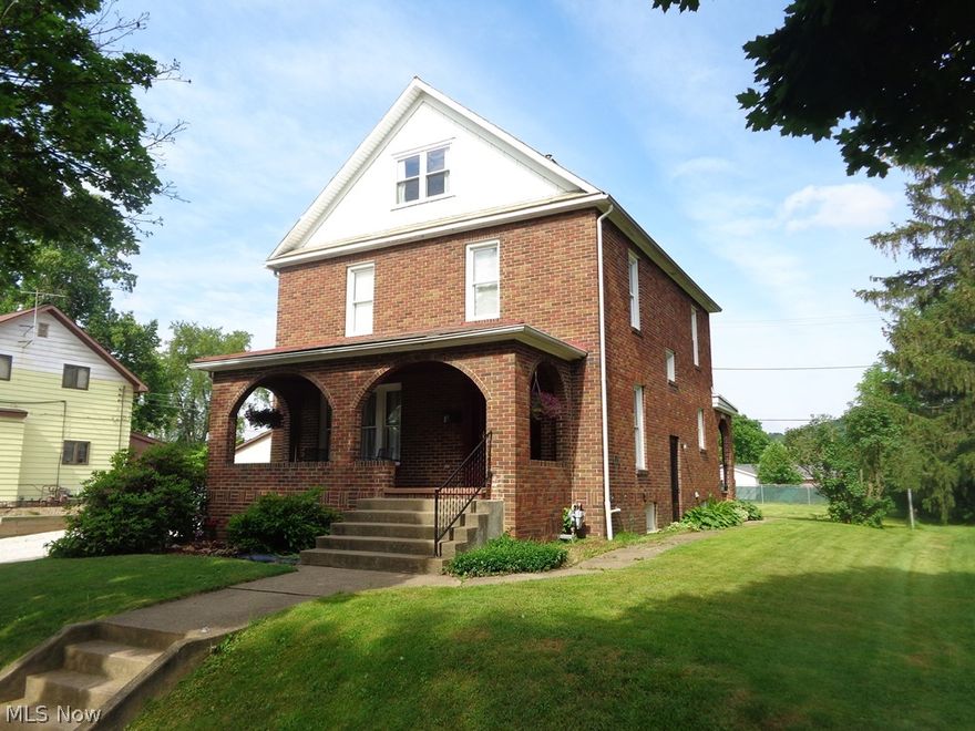 Amazing Brick 2 Story on Large Lot. Spacious front porch, updated windows, refinished hardwood flooring, new roof on flat area, updated wiring and plumbing, first floor laundry and full bath combined, double stairway leading to kitchen or living room, many possibilities with attic, don't miss this one!