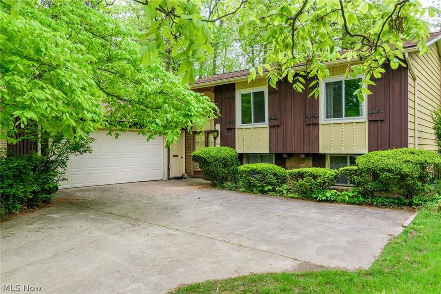 WOW! Amazing opportunities await here at 109 Hickory Hollow Drive in beautiful Amherst, Ohio. This 4-bedroom, 2.5 bath split level is truly one of a kind! Nestled on a quiet cul-de-sac street. Serene treed lot. Many breathtaking architectural features throughout this home including the grand vaulted foyer with double closets, vaulted ceilings in the eat-in kitchen, living room and formal dining room, skylight in the kitchen, arched doorways, and a beautiful brick fireplace with built-ins on each side. Bountiful natural light shines throughout the home. All the rooms in the home are very spacious. Plenty of storage space and large closets. All appliances stay with the home. The home also has a newer roof and hot water tank. Another unique feature of this property is the OVERSIZED ATTACHED GARAGE- 660 SQ FT. Currently set up as a 2 car with workshop area but could easily be converted and has capacity to fit 3 cars or other toys. Fast occupancy available. Call today for your personal tour