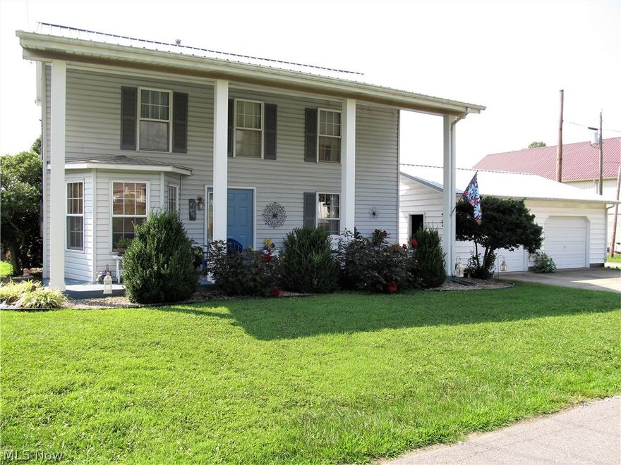 Fantastic and clean 4 or 5 bedroom, 2 bath Colonial with updates galore features all one floor living, a nice large and level backyard with privacy fence all around, double car detached garage measuring 28 x 26, all newer carpet and flooring throughout the entire home, nicely updated kitchen with all new stainless appliances, both baths recently updated, new composite deck and back porch plus balcony recently added, metal roof on house and garage 2011, HVAC's 2012 and 2018. From the plantation-style front porch, the main level offers a large living room and family room, master bedroom, guest bedroom, full bathroom, nice eat-in kitchen, and laundry. The upper level offers 2 bedrooms, separate walk-in closet, a full bath and 26 x 16 bonus room with balcony currently used as a 2nd master bedroom but would also make a great media/family room or playroom. A super convenient location close to schools, pharmacy and shopping.