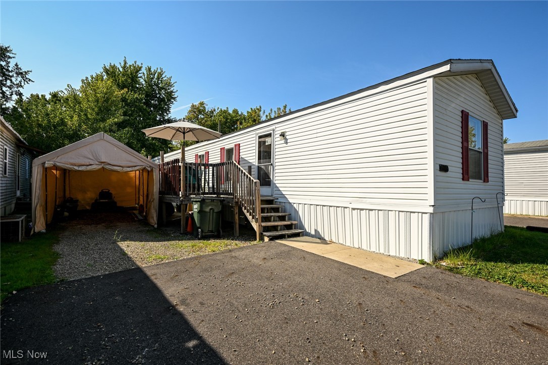 Welcome, welcome, welcome! On the hunt for a great mobile home, but hate that there's never enough parking or storage? Your search stops here! This fantastic 1997 Holly Park is officially available! Featuring a paved parking area, an extended gravel area and carport to accommodate 3 cars total! Don't miss the huge shed tucked behind the carport to take care of all you extra storage needs too! A nice wooden deck, with room for a patio set, is the prefect spot to relax outside. Inside is a spacious open floorplan. Large living room with new flooring and eat-in kitchen are the hub of the home. Down the hall you will find convenient in unit laundry and both the washer and dryer stay! The full bathroom has a tub/shower combo and has plenty of space to move around in. At the end of the hall is a great sized bedroom with newer carpet and large closet. Off the living room is the largest bedroom. In the last 8 years the home has received a lot of awesome updates- new full size water heater, new flooring and subfloor, partial new roof, new A/C, some new walls (including insulation), new gas line, some new plumbing and lighting and paint! Don't miss your chance!!