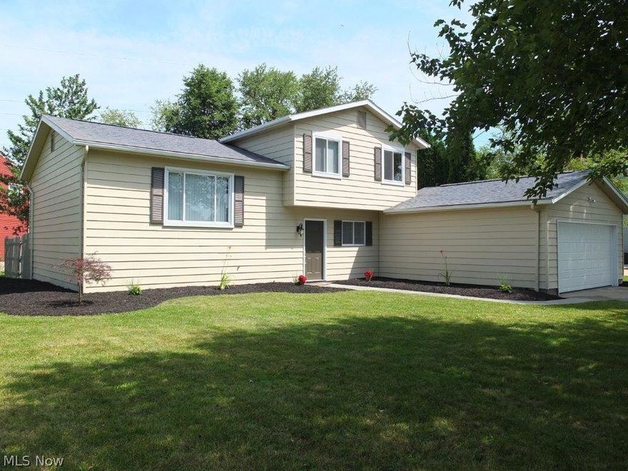 Completely updated 3 bedroom, 1.5 bath split level on great corner lot! Great floor plan with open living room, kitchen and dinette. The remodeled kitchen has glass tile backsplash, breakfast bar seating for 4, stainless steel oven, range, dishwasher, microwave and extra large sink. Nice dinette with tile floor. Lower level family room has a beautiful stone fireplace. 3 bedrooms and updated full bath with new tile floor, new vanity with solid surface countertop and tile shower on the 2nd floor. New flooring throughout the entire home! Large foyer with tile floor. Half bath in the lower level too. Completely private backyard with 2 patios including one covered patio, storage shed and privacy fence. Great location in a quiet neighborhood. Make an appointment to see this home now!