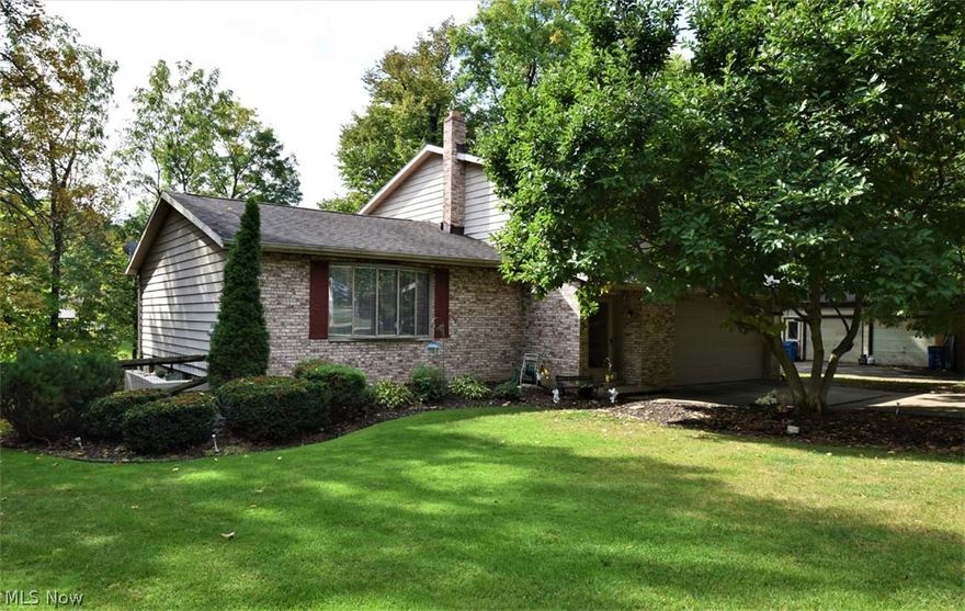 Don’t miss this spacious 4 level split in Macedonia!  Large living room with vaulted ceilings, dining room, eat in kitchen and half bath greet you on the main level. Step down to an ample sized family room with wood burning fireplace and wet bar. Upstairs you will find 4 nicely sized bedrooms and full bath. Master has double closets and full bath en suite. A rare split level find, you also have a basement with an additional recreation room, perfect for a kids hangout or man cave! Laundry in basement also. Outside you will find a 4 level, partially covered deck for entertaining and a partially fenced yard. An attached 2 car heated garage with water and electric finish off this great home. All appliances stay and seller is offering a home warranty!