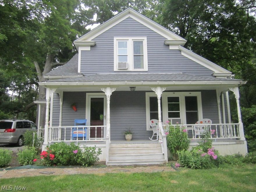Charming Century home on 1.41 acres. First floor bedroom and bath.Front porch and covered patio .Large out building and unique underground root cellar.New roof in July.
