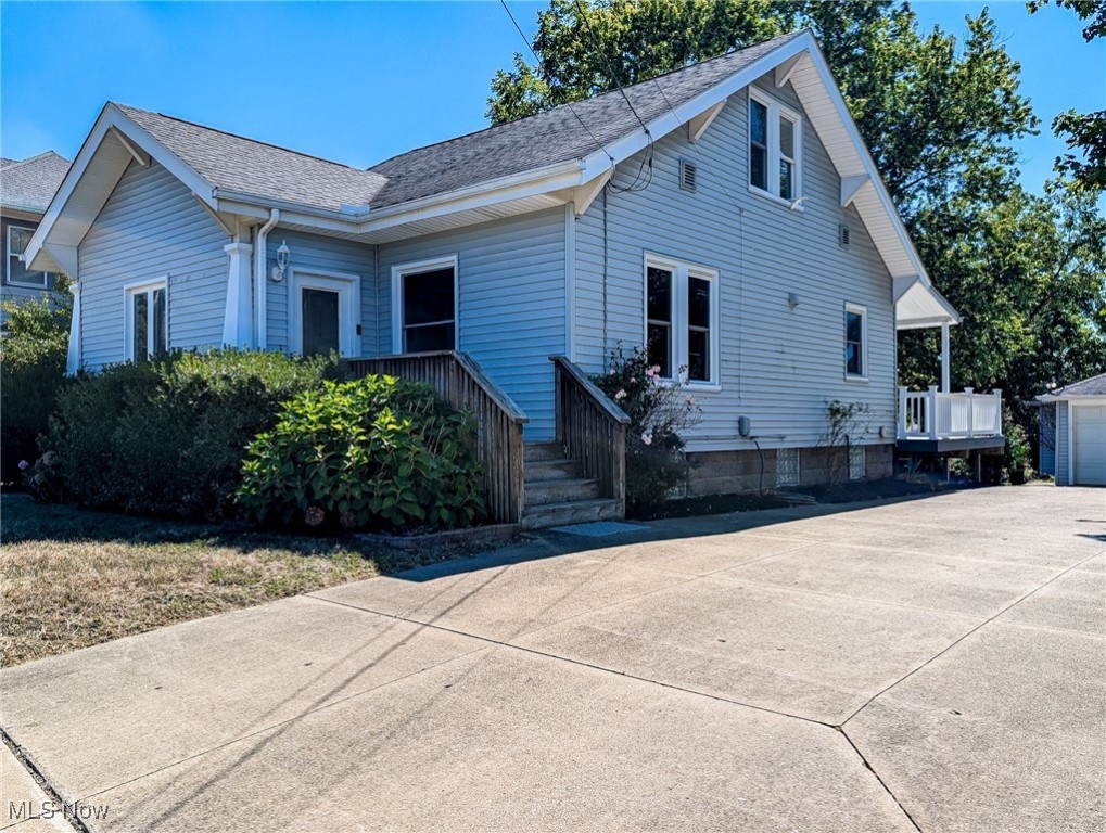 Welcome home to this beautiful 4-bedroom, 2 bath home sits on almost an 3/4 acre of land in Suffield Township/Mogadore. A dream of a classic and timeless home with original woodwork and built ins. A 6 car garage(s) awaits the car enthusiasts. 3 of the garages are heated! 1 garage bay has a 10' door. So much flexibility and space. Welcome your guests onto the covered composite deck into the very spacious eat-in kitchen with its beautiful oak cabinets, & lots of extra counter space. The dining room features hardwood floors & original built-in cabinets as well as a lovely window seat. On this same level you will find a spacious living room, office/library, bedroom, and bath with a jetted tub for easy first floor living. Upstairs will lead you to 3 additional bedrooms & the roomy second bathroom which features a sky light. The basement is also finished offering a large family room with a bar area. The the multi-level composite deck, overlooking the large and private backyard, is a great space for inside outside entertaining! New Carpet and paint throughout. Nothing to do but move in. New siding, trim, roof & gutters on all structures in 2007, all windows are newer with some replacements as recent as 2021. Did I mention the 6 car garage!