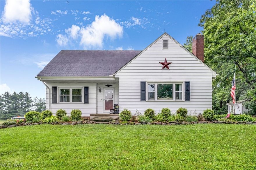 Welcome to 3584 Northampton Rd in Cuyahoga Falls, a charming 3-bedroom, 2-bathroom cape-cod home nestled on an expansive 6.05-acre lot that offers the perfect blend of comfort, privacy, and natural beauty. Boasting 1,492 square feet of inviting living space, this home features cozy bedrooms, a warm fireplace centerpiece, and seamless indoor-outdoor flow ideal for entertaining or relaxing. The kitchen stands out with black appliances, custom cabinetry, and a large island with a breakfast bar for casual dining. Step outside to enjoy a spacious patio and deck overlooking the above-ground pool and sweeping backyard views, perfect for summer gatherings. A wide driveway leads to a detached three-car garage and storage shed, providing ample parking and workspace. Whether sipping coffee on the porch, swimming in the pool, or exploring your private acreage, this property is a rare retreat while still conveniently close to local shops, schools, and parks. Experience the best of country charm and convenience in this Cuyahoga Falls gem. Schedule your private showing today and make this house your new home.
