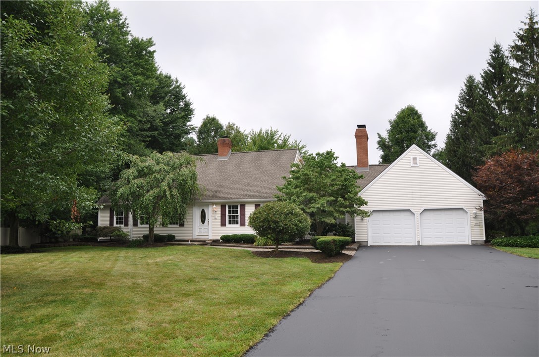 Move right into this beautiful Cape Cod with many updates. Enjoy the remodeled kitchen w/stainless appliances, quartz counter tops, large island, laminate flooring & separate eating area. The formal dining room & living room features newer laminate flooring & crown molding, the family room has new carpeting, a woodburning fireplace w/gas starter & glass doors that lead to an all-season sun room w/hardwood flooring. The 1st floor master suite has a large walk-in closet, tiled glamour bath w/jetted tub & separate shower. There is also a 1st floor laundry & half bath as you enter from the over-sized 2 car garage. the upstairs of this lovely home has 3 generous, newly carpeted bedrooms - one with it's own private full bath & huge walk-in closet, an additional full bath & large carpeted storage area. The basement is finished w/drywall & vinyl flooring - perfect for a rec room, exercise, hobby room, workshop or just additional storage space. The exterior has vinyl siding, tiered decking, a s