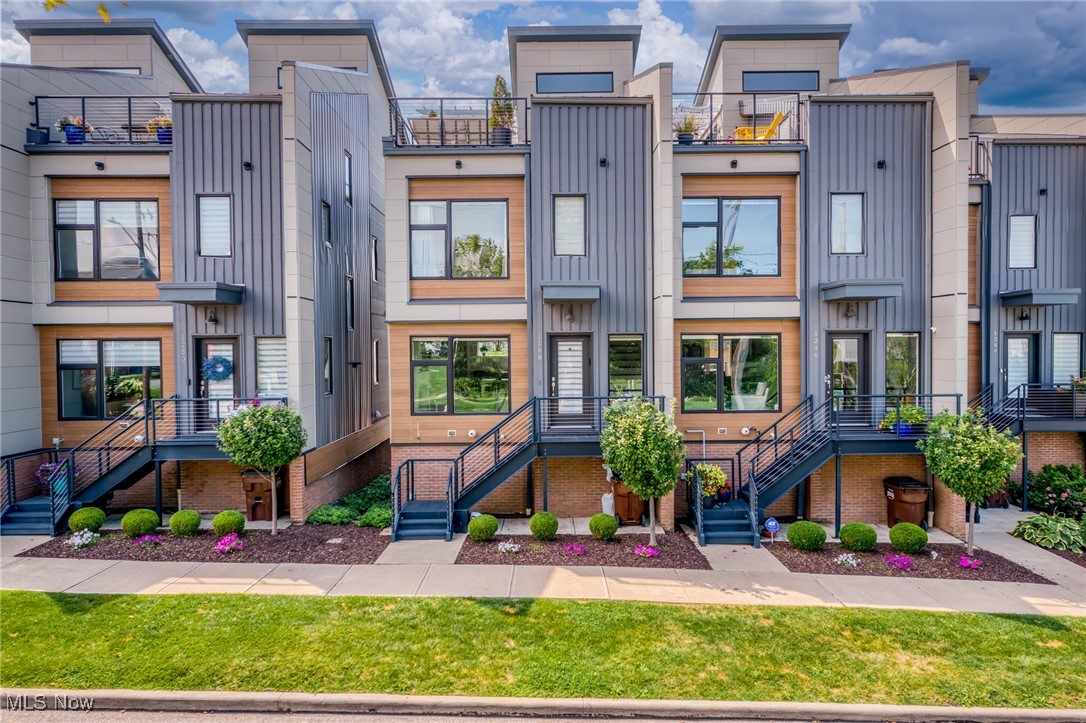 Discover the perfect blend of lakeside tranquility and urban energy in this remarkable four-level end-unit townhome. Located in the highly coveted Breakwater Bluffs community, this is the only "Skyline" Model to have resold. As named, this unit features direct City and Lake views! Take comfort in knowing that your view will forever remain unobstructed, thank to the Metroparks Connector across the street.
Live where Cleveland’s best amenities come together — in this stunning four-level end-unit townhome. Here, every detail is designed to elevate your lifestyle. Step inside and feel the natural light pouring through oversized windows, highlighting an open great room with a chef’s kitchen built for gathering. Quartz countertops, premium KitchenAid appliances, 42" cabinetry, and Acacia wood floors set the stage for effortless entertaining. The lower level opens to a wide, versatile bonus room—ideal for a home office, gym, or lounge. Attached two-car garage is heated, with an electric car charger and custom storage shelves.
Your primary suite is a true retreat, complete with a custom closet system and a spa-inspired bath featuring double sinks, quartz counters, and a glass walk-in shower. Upstairs, the fourth-floor all-season, entertainment level is ready for every occasion. Glass sliders lead out to a vast private rooftop deck, making for unforgettable evenings on your private rooftop deck, soaking in the views. Contrary to other models in this community, the Skyline unit offers a front row seat to your Fourth of July Fireworks!
Enjoy LOW taxes until 2035 with 10 years remaining on your property tax abatement. With energy-efficient upgrades, and low maintenance, this home pairs everyday comfort with long-term value. Rare guest parking lot with 18 visitor spots! Just steps from the Metroparks Lake Erie connector and only minutes to Edgewater Beach, Gordon Square, and Downtown Cleveland, this home captures the very best of location, lifestyle, and luxury.