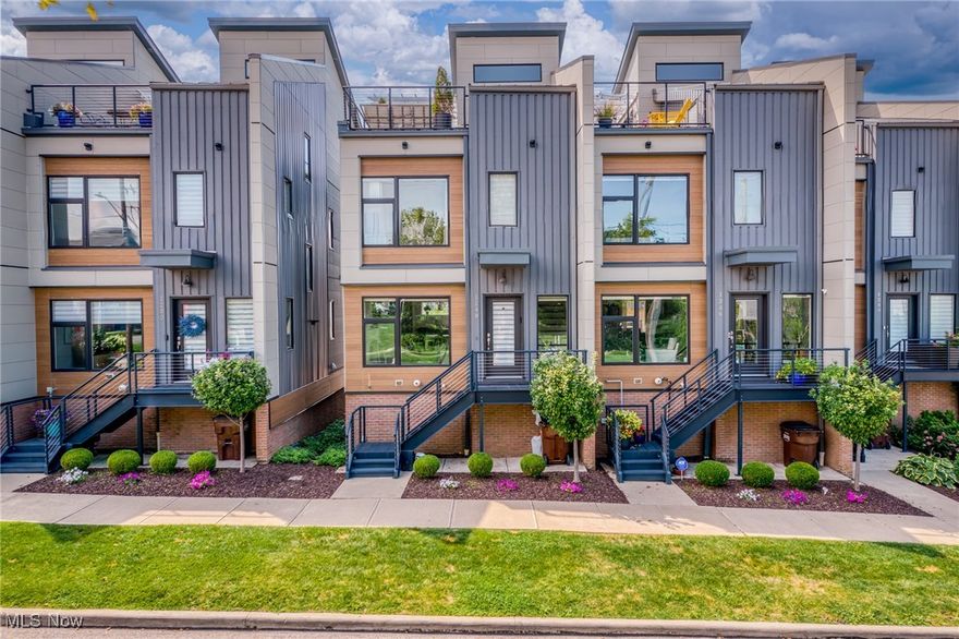 Discover the perfect blend of lakeside tranquility and urban energy in this remarkable four-level end-unit townhome. Located in the highly coveted Breakwater Bluffs community, this is the only "Skyline" Model to have resold. As named,  this unit features direct City and Lake views! Take comfort in knowing that your view will forever remain unobstructed, thank to the Metroparks Connector across the street.

Live where Cleveland’s best amenities come together — in this stunning four-level end-unit townhome. Here, every detail is designed to elevate your lifestyle. Step inside and feel the natural light pouring through oversized windows, highlighting an open great room with a chef’s kitchen built for gathering. Quartz countertops, premium KitchenAid appliances, 42" cabinetry, and Acacia wood floors set the stage for effortless entertaining. The lower level opens to a wide, versatile bonus room—ideal for a home office, gym, or lounge. Attached two-car garage is heated, with an electric car charger and custom storage shelves.

Your primary suite is a true retreat, complete with a custom closet system and a spa-inspired bath featuring double sinks, quartz counters, and a glass walk-in shower. Upstairs, the fourth-floor all-season, entertainment level is ready for every occasion. Glass sliders lead out to a vast private rooftop deck, making for unforgettable evenings on your private rooftop deck, soaking in the views. Contrary to other models in this community, the Skyline unit offers a front row seat to your Fourth of July Fireworks! 

Enjoy LOW taxes until 2035 with 10 years remaining on your property tax abatement. With energy-efficient upgrades, and low maintenance, this home pairs everyday comfort with long-term value. Rare guest parking lot with 18 visitor spots! Just steps from the Metroparks Lake Erie connector and only minutes to Edgewater Beach, Gordon Square, and Downtown Cleveland, this home captures the very best of location, lifestyle, and luxury.