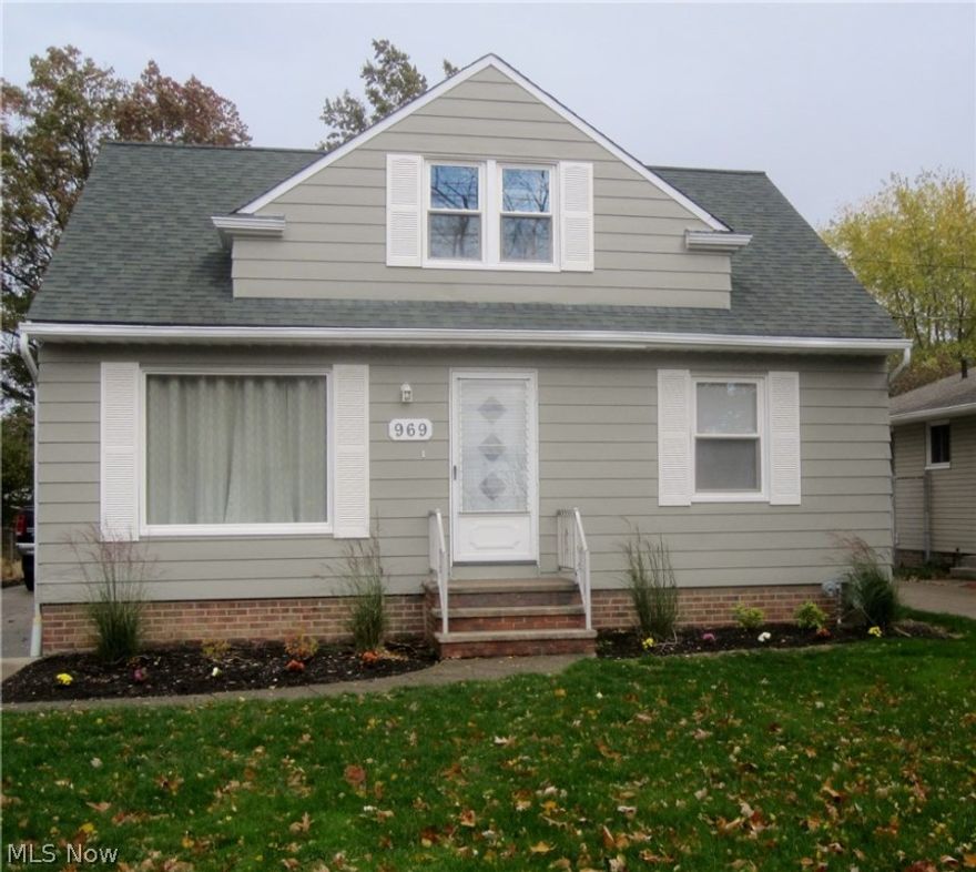 Welcome home to this updated bungalow with gleaming hardwood floors throughout. Spacious living room with large picture window, updated kitchen with ceramic flooring, two lovely bedrooms on the first floor, and huge upstairs bedroom with much built in storage and large closet. This home offers an updated electrical system, newer windows and roof, central a/c, and a paved driveway leading to a two car garage.  The full basement offers a recreation room area with glass block windows. Close to parks, shopping, and freeway access. Great curb appeal.  All freshly painted and just waiting for you to move right in.