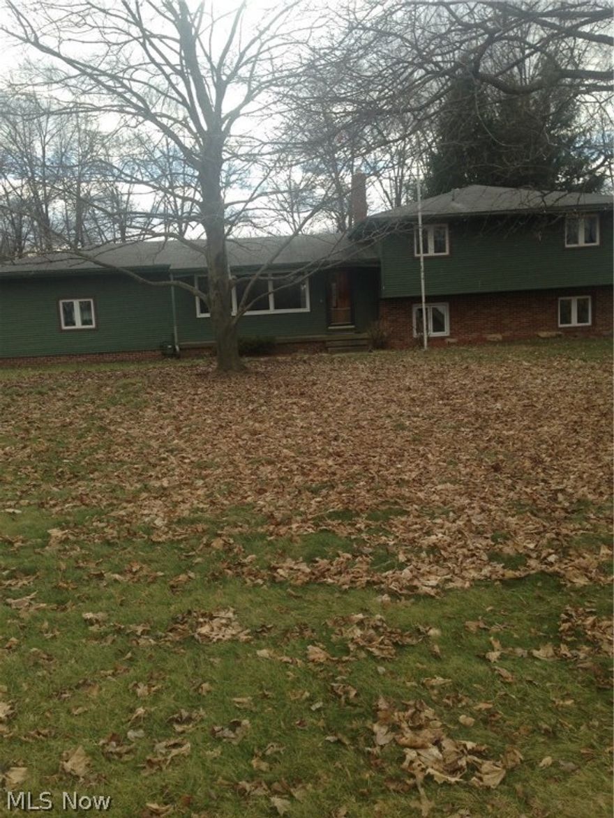 Worth a second look! This split level home in the Weathersfield school district has 3 large bedrooms upstairs which are freshly painted in an inviting neutral color.  There is a 4th bedroom on the lower level, along with a family room featuring a gas fireplace.  This home also features an in-law suite with a kitchenette, full bathroom and its own private entrance.  4 car garage is any mechanic's dream and has enough room to store a semi trailer or RV, and its attached room makes the perfect outdoor gathering spot for friends or a great "man cave".  Wood deck features built in benches and a hot tub.Come check out some of the recent repairs that have been completed on this beautiful home that have it on its way to being just stunning again!