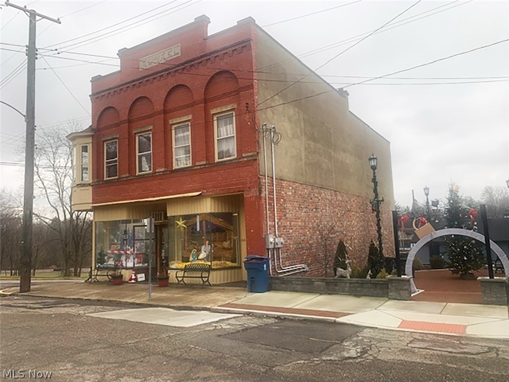 Investment Opportunity! 2-story downtown building - Vet office occupies main level (rent $750 a month plus utilities - owner pays water & sewer - separate furnace, gas & electric meters) - 2 upstairs 1 bedroom apartments (currently vacant - rent was $525 a month - owner paid utilities) - additional 1 bedroom apartment in basement (rent was $450 a month) - Rubber roof re-done approx. 3 years ago - Ohio State Waterproofing warranty transfers - street parking - Building has been well maintained - Owner also selling additional investment property at 275 Front St. (see MLS #4432290).