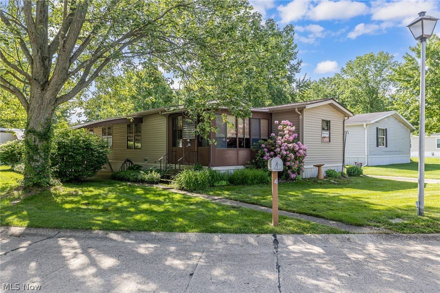 COLUMBIA Park IS A 55 AND OLDER CONCEPT OF LIVING and is Ohio’s Premier Adult Land Lease Community! Amenities Include: Gated entrance! On site Shopping Plaza! On site Management! Walking Path/Dog Walking Path! Shuffleboard! Bocce Ball! Library! Crafts, and Social Hall! WELCOME HOME to this adorable 1981 Schult Singlewide Manufactured Home offering 1152 sqft. (48 x 24)
featuring 3 Bedrooms, 2 Full Baths, Formal Living room with a wood burning fireplace and Dining Room, Eat in Kitchen, Laundry Room and a 3 Season Sunroom, same level.  This home has had one owner and sets on a very nice corner lot way in the back of the park.  Most of the updates were completed 2013, Vinyl siding, Roof, HVAC System, All doors replaced other than the enclosure, Carpeting and the Chimney were replaced as well. The Range and Refrigerator were replaced in 2025/2026.  Current owners take great pride in offering their home to the new owner.  Olmsted Township and Olmsted Falls are two very quaint communities sharing the same post office and experiencing the exciting downtown where the Grand Pacific Junction is located for your entertainment, shopping and fine dining.  Columbia Park is close to highways, and all types of shopping.....  Why not come and take a peek.....
