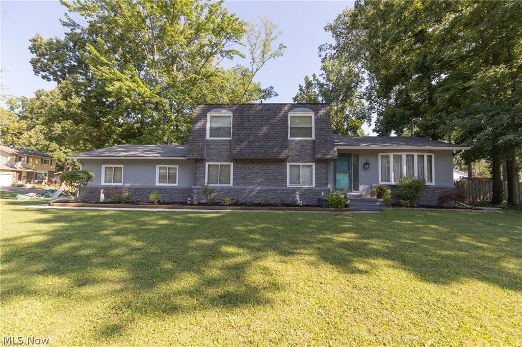 3-bedroom split-level home on a spacious corner lot in Amherst. Freshly painted. Neutral colors throughout. Vaulted ceilings in the living and dining rooms. The kitchen has maple cabinets with soft-close drawers, granite countertops, and a spacious pantry. The family room is a cozy spot to relax with a beautiful gas fireplace flanked by custom wooden shelves with accent lighting. The lower level features a flex room that is currently being used as an office. Part of the basement has the potential to be a game/media room. Newer updates include: gutters, upstairs windows, (stone facade on the house and new driveway completed 2 years ago). The insulation in the attic has been upgraded to current standards. Extra insulation was added above code. The wooden privacy fenced backyard is the perfect place for entertaining/relaxation with a large 2-level deck, and a 12' x 16' workshop shed with two separate 110 lines. Close to schools. Schedule your private showing today!