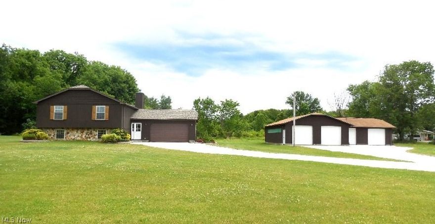 4 bedroom Bi-level home with 3,500 square foot detached garage/shop with 4 overhead doors for super handyman.  Just on the edge of Jefferson Village, home is in just LIKE NEW condition.