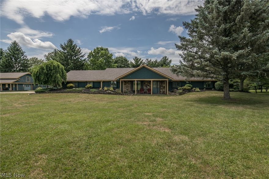 Great opportunity with this 3 bed, 2.5 bath Ranch on 3 acres! Enjoy the privacy of country living while still being located in close proximity to major Highways. The sprawling floor plan features foyer with tile flooring which opens into the spacious great room. The great room has a vaulted ceiling, wood burning fireplace with storage for extra wood, and French doors that open to the sun room. The sun room also features a vaulted ceiling, a Lopi wood burner surrounded by brick, and lots of natural light from the windows overlooking the property. The custom kitchen boasts granite counters, under cabinet lighting, center island, cherry hardwood floors, and all stainless appliances. The dining area is conveniently right off the kitchen and has hardwood flooring as well as crown molding. All three bedrooms are generously sized, including the master bedroom that offers plenty of storage in the dual closets, and a private master bath. This unique property has a 2-story barn with cement floor