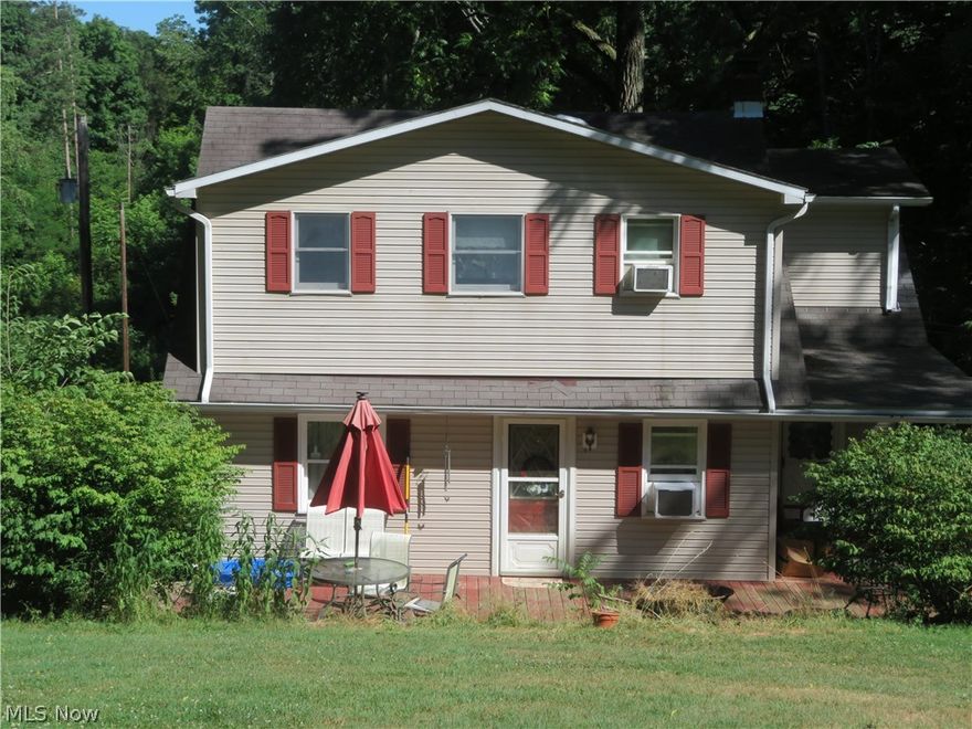 Cozy 3 BR., 2 bath farm house tucked into almost 14 acres of beautiful Carroll County.  Natural walnut hardwood floors in L.R. & D.R.  Kitchen recently upgraded with new ceramic tile flooring, paint, and all new appliances. Main floor bath recently remodeled, adding a washer/dryer to main floor. The upstairs has three bedrooms and a full bath. The property has a large, classic wooden barn with two-three stalls leading to newer three strand tensile fencing.  There is also a chicken coop, an equipment shed, a newer “ Weaver” barn and a detached 2 stall garage. The sprawling tree filled yard has a grape arbor, black raspberries, asparagus, and black walnuts. The spring time comes alive here with hundred of daffodils an other perennials. The paved driveway area is highlighted with beautiful rock wall areas. Very peaceful, quiet area, yet close to SR. 39. Two heat sources, fuel oil and/or wood burner.   Brand new water well, as we switched from spring water. Only second family to live & lov