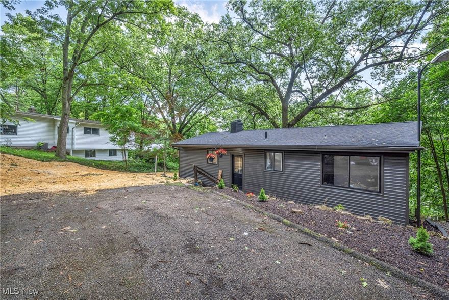 Fabulous opportunity to own this one of a kind home, on the hill. Beautiful views, tucked away and private! Updates include a brand new roof, Waterproofed basement, All new plumbing, New light fixtures, Full bathroom renovation, Full open concept kitchen, New vinyl and carpet flooring, Recessed lighting, Paint and so much character! You'll fall in love the minute you walk in the front door. Seller plans to offer a credit to replace the AC unit at closing.