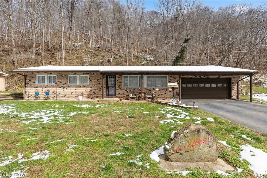 Charming brick ranch offering 3 bedrooms, 2 full baths, an attached garage, and exceptional outdoor amenities. Beautiful front landscaping showcases a variety of perennials, while abundant natural light fills the home with a warm, inviting feel. Features include electric heat, central air, and a 200-amp electrical service with GFCI protection. The updated kitchen boasts granite countertops, new cabinetry, and includes all appliances—range, refrigerator, dishwasher, washer, dryer, and Generac generator. The eat-in kitchen opens through sliding glass doors to a private rear porch overlooking a peaceful wooded setting. A convenient laundry room sits just off the kitchen. Additional outbuildings include a 10×12 shed and a spacious 30×15 workshop/she-shed/man cave. The attached garage offers ample storage beyond parking. Situated on a private yard, the seller states the home has never experienced flooding from the nearby creek. Schedule your showing today!