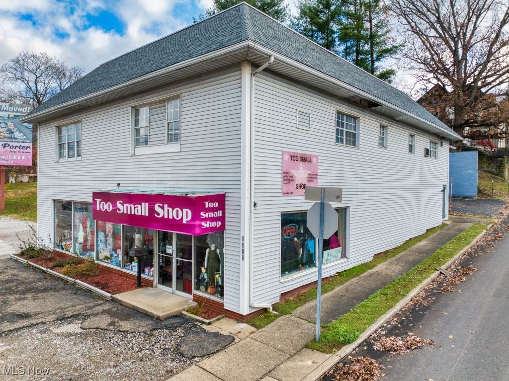Explore the opportunity at 1100 Murdoch Avenue, Parkersburg, WV, a generous 5,400 sq ft mixed-use commercial property now on the market. This building spans three parcels along Murdoch Avenue, which experiences an average daily traffic count exceeding 17,000. The ground-level retail space is currently vacant and is a blank canvas allowing a new tenant endless possibilities, while the upper-level features two professional office suites, each measuring 1,200 sq ft, complete with a reception area, three private offices, restrooms, conference rooms, and dedicated parking, with one office being handicap accessible. Additionally, the property includes a billboard generating $200 monthly or $2,400 annually. Recent upgrades include a new roof installed last fall, and its prime location offers easy access to Camden Clark Medical Center, dining, shopping, and more.