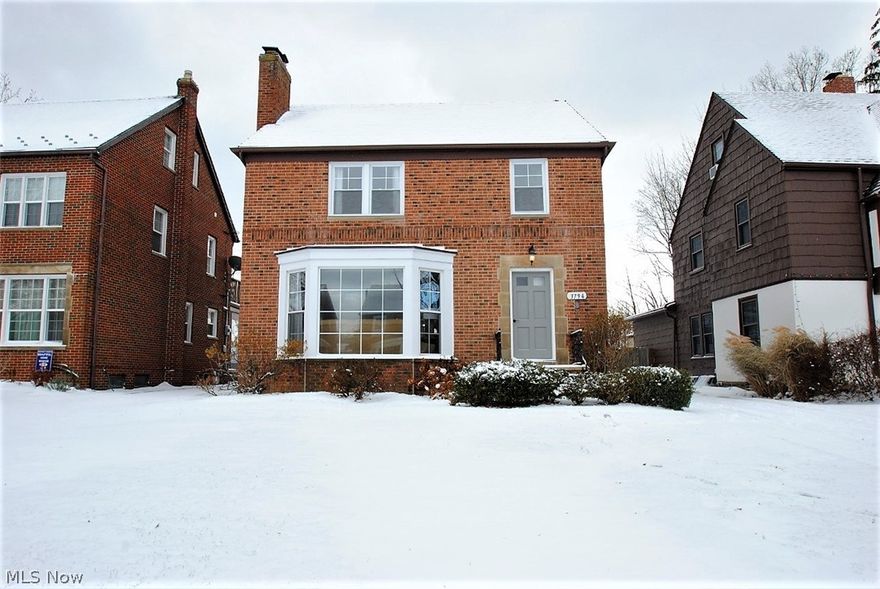 WOW! A fantastic renovation straight out of HGTV.  Hang out in this open white Kitchen with new cabinets, floors, granite counters & a peninsula to pull up a few stools with gorgeous pendant lights. The Kitchen / Dining Room doorway was widened to have a more open feel. The Dining Room & Living Room have gorgeous floor to ceiling windows & there is an extra room off the back of the Dining Room for an Office or Family Room. The half Bath is at the stairs for easy access to the finished Lower Level & first floor. The beautiful Lower level has new laminate floors & a second  fireplace. The second floor has 3 bedrooms & the largest Bathroom I've seen in University Heights with an extra seating area for a perfect separate vanity.  Furnace, A/C, water tank, dishwasher, range, microwave are all new! A perfect location and close to the new University Heights Community Park near Silsby & Fenwick and the newly renovated library! Many newer windows & tile roof has been professionally repaired. Hu