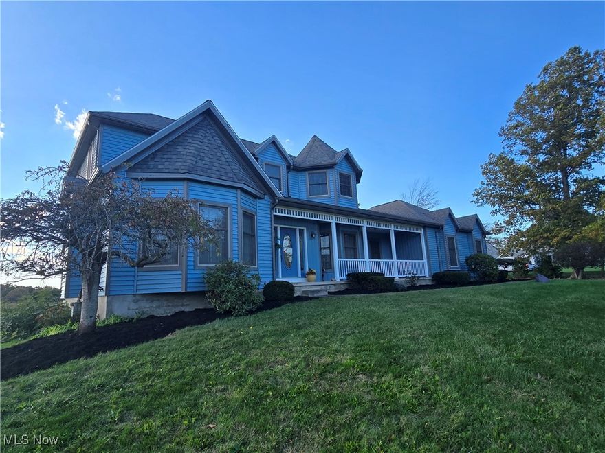 Beautiful Colonial home with country covered porch overlooking gorgeous front yard. This home sits on 6 acres (2 partials). Custom built home where owners thought of everything. Formal living room has a gas fireplace, formal dining room with crystal chandelier. First floor owners suite with walk in closet, jetted tub, double vanity and central vac. Kitchen/great room with vaulted ceilings, open floor plan, custom cabinetry, solid surface countertops, gas fireplace, built in bookshelves, top of line appliances include wall oven, microwave, range/oven, refrigerator, and dishwasher. Making this living area the family hub. First floor laundry and bath rounds off the main level. The entrance foyer with wooden staircase leads to the second floor with spacious bedrooms and bath. Each bedroom offers walk in closets and one bedroom even has a cedar closet as well. The bath is separated with a shower/commode area and double vanity and linen closet space. Center hall closet offers additional storage. Onto the lower level walk out basement offering a full bath, kitchenette, fruit/canning storage, and built in shelving. Perfect for extra living space or office. So many features throughout this home with central vac, whole house generator, built in alcoves for personal touches, water filtration system, built in safe, cedar closet, the list goes on. This homeowner thought of everything. The rear yard you will find a 30x40 outbuilding with electric for hobby enthusiast and a storage shed for all the gardening tools. The six (6) acres backs up to the Springfield Metro Parks bog. View this home and fall in love.