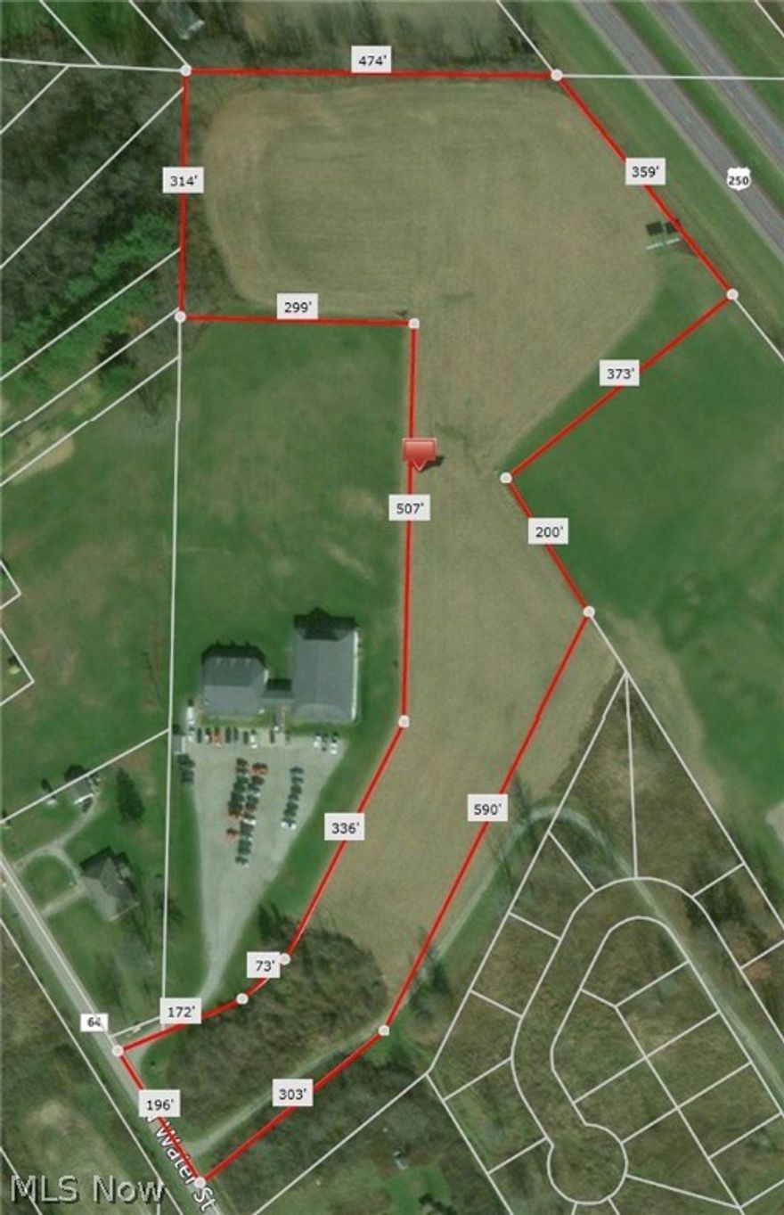 9+ acres.  196' of frontage on North Water Street Extension providing access to the property.  Visibility from State Route 250 with 359' of frontage.  Gas lines, water and sewer lines at the street.  Zoned business, light industrial.  Many possibilities.