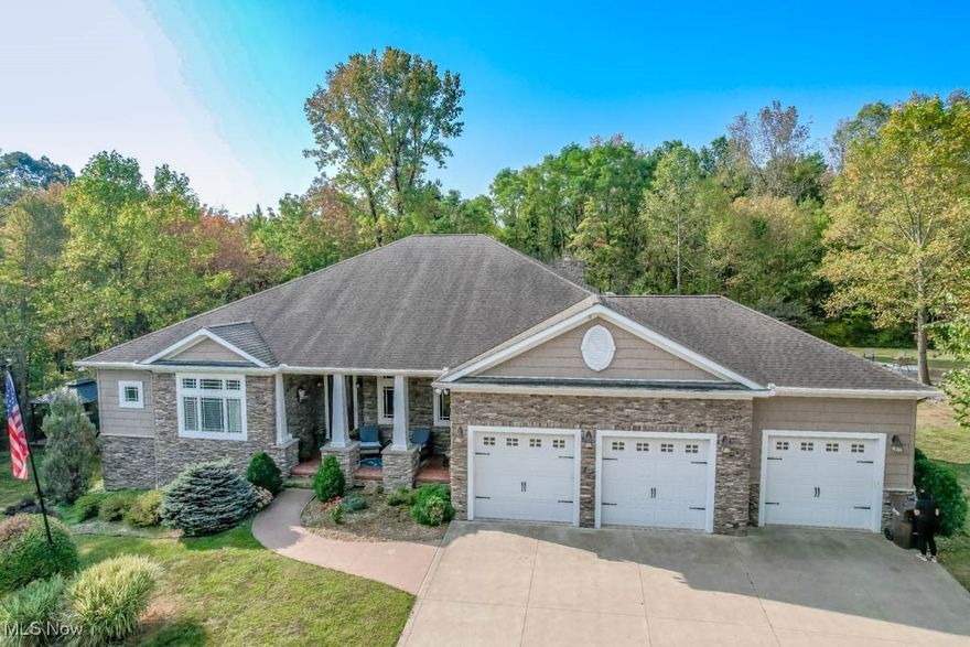 Set back on nearly 13 wooded acres, this custom built home delivers the privacy and space you’ve been looking for! A long drive leads to a beautiful retreat where quality craftsmanship is easy to see, with room for both everyday living and entertaining.

The living room centers around a fireplace and opens to the eat in kitchen with granite countertops, tile backsplash, stainless steel appliances, and Schrock cabinetry plus plenty of dining space. Just off the main living area, a library with built in bookcases and hardwood floors creates a quiet spot to read or work. Down the hall, three bedrooms and two full baths include the master suite with a sitting room, large walk in closet, and a private bath with separate vanities, a garden tub, and step in shower. The secondary bedrooms share a Jack and Jill bath with twin vanities. A main floor laundry with washer and dryer included, along with a guest bath, add even more convenience.

Upstairs, a recently finished space gives you the option of a fourth bedroom or bonus room with its own full bath. The walk out lower level expands your living area with a spacious rec room, home gym, workshop, and another full bath, all set on a 13 course basement.

Extra highlights include 8' doors throughout, a heated 3 car attached garage, 400 amp electrical service, and a back up generator.

The space to entertain continues outside with a paver patio, gazebo, fire pit, new swing set, and shed for storage. A negotiable hot tub and detached garage add to the appeal, making this private retreat one you won’t want to miss. Schedule your showing to see all this home has to offer today!