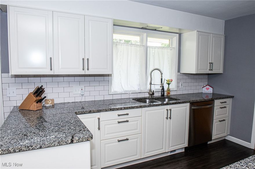 Charming 3-Bedroom Ranch Home for Sale in Established Neighborhood! Discover this extensively updated 3-bedroom, 1-bath ranch home, perfectly situated in a welcoming community. This home has undergone significant renovations from 2015 to 2016, blending modern comfort with classic charm. Key Features: Stylish Interiors: Enjoy beautiful hardwood and vinyl flooring throughout, creating an inviting atmosphere. Gourmet Kitchen: Cook and entertain in the well-appointed kitchen featuring granite countertops, a chic tile backsplash, abundant counter and cupboard space, and newer stainless steel appliances. Bright Dining Area: A separate eating area flooded with natural light makes every meal a delight. Cozy Living Room: Relax in the spacious living room, complete with an electric fireplace and built-in shelving for your personal touches. Updated Bathroom: The bathroom boasts granite countertops, elegant wainscoting, and newer cabinets for a fresh, modern feel. Outdoor Comfort: Step out onto the patio and enjoy summer evenings in your private backyard oasis. With newer exterior doors and a newer garage door, peace of mind comes standard. Functional Basement: Glass block windows enhance the basement, adding both light and security. Don’t miss your chance to own this beautifully updated home in a great neighborhood! Schedule a showing with us today!