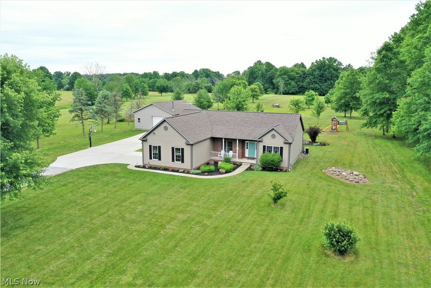 Postcard setting! Wow! Welcome to these 7 acres of tranquil setting, three-bedroom, two full bath ranch home. Come on in from the front porch to the inviting foyer which is open to the large living room offering a brick fireplace with mantle and the bright kitchen. Freshly painted and new modern lighting, new vinyl plank throughout. The luxury chef's kitchen offers Quartz counters, soft close cabinets, high-end stainless-steel appliances, bar counter, and is open to the dining area with plenty of windows to let the natural light to shine through and has a slider door to the large backyard deck where you can sit out and enjoy the gorgeous views. There is another room off of the kitchen currently used as a play area but could be an office etc. Still on the first level there are three bedrooms with new carpet, remodeled guest bathroom and the master suite has a full bathroom with his and her sinks. Mudroom, laundry room. The large lower level is unfinished offering more room for storage.