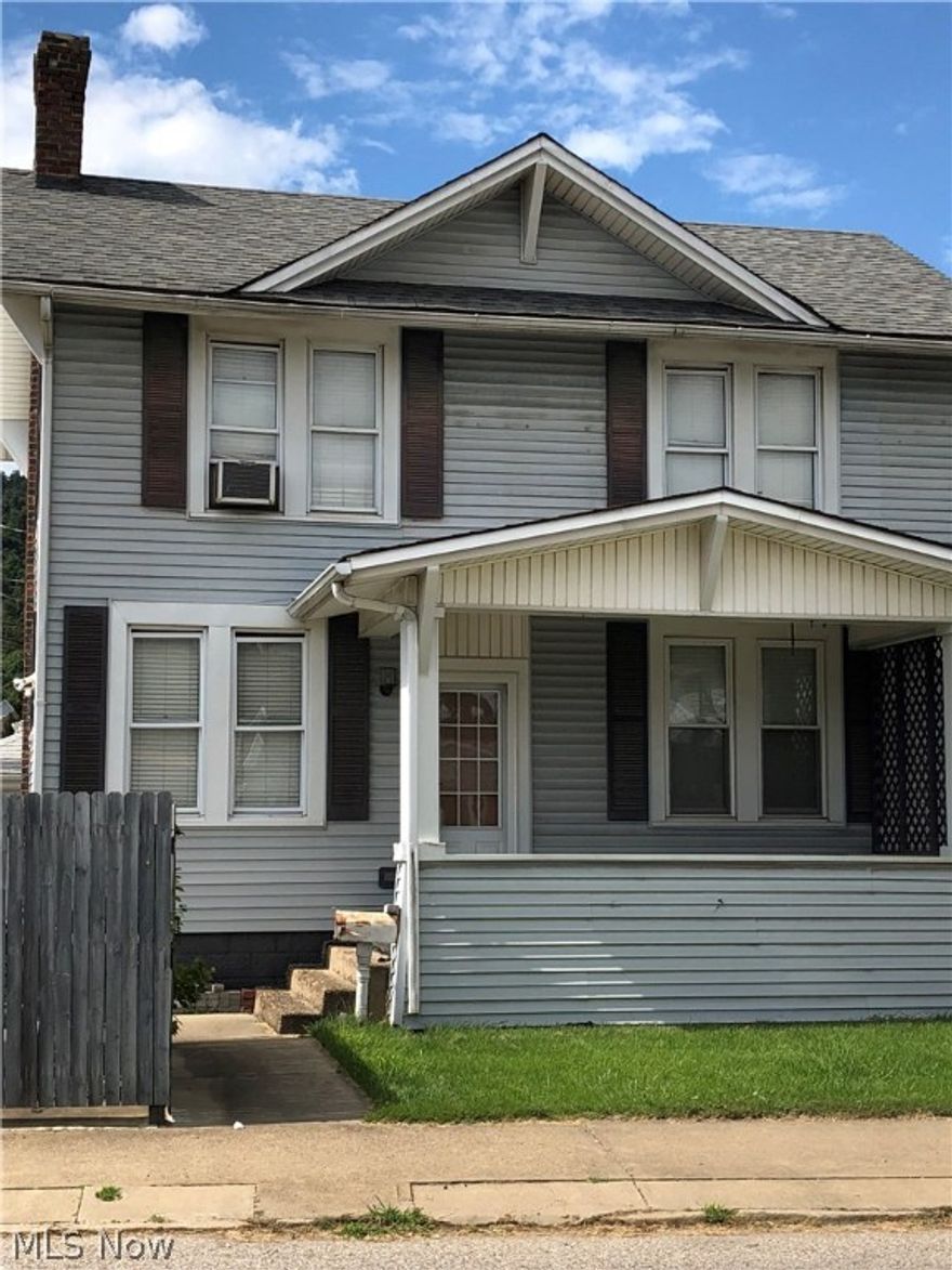 Kitchen has oak cabinetry and main floor has half bath off kitchen.  Two large bedrooms and full bath on second floor.  Off street parking with paved driveway.