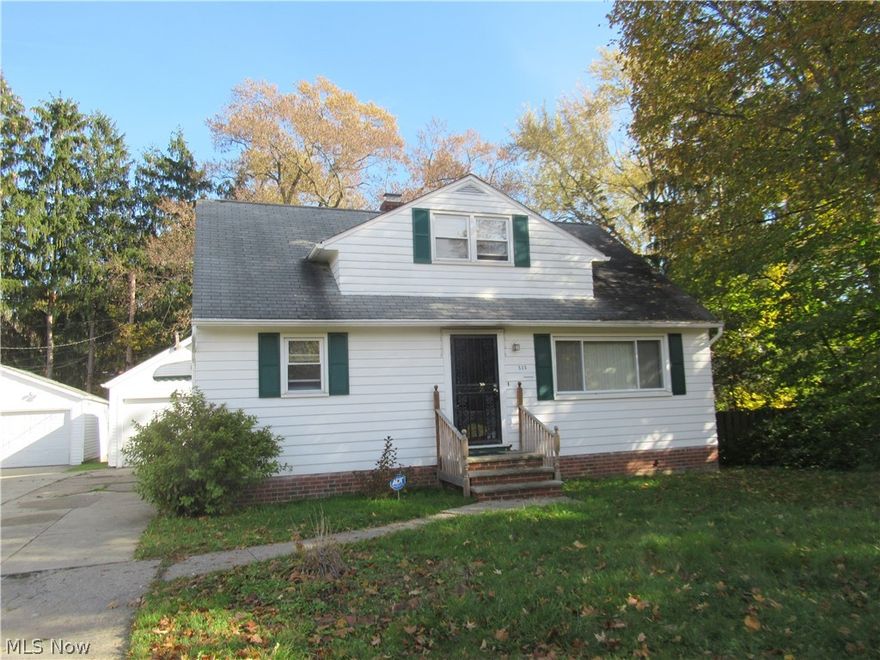This delightful home  on a private street in Bedrord features hardwood floors, spacious bedrooms, and a partially finished lower level. It is just waiting for your finishing touches. Step inside to the open living and dining area, which features a picture window and gleaming hardwood floors. The kitchen has been remodeled featuring an almost new range and a fridge, plus plenty of beautiful cabinetry. Two spacious bedrooms and a full bathroom complete the first floor. Upstairs, you will find the incredibly spacious master bedroom with tons of closet space! The full lower level includes a finished rec room, a laundry area, and plenty of space for storage. Located just off of Columbus Road in Bedford, this home is convenient to area shopping, dining, and highways. Do not miss this one!