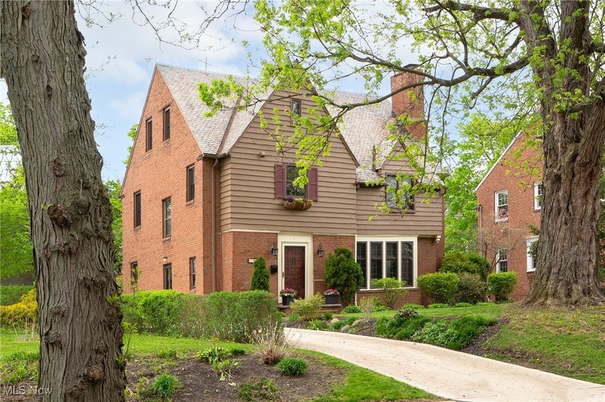 Step inside to see the sunlight dancing through leaded-glass windows, casting a glow on rich woodwork all around. Beyond each original 8-panel door, there is another detail to make you smile — from the original tile in the foyer, to the wrought iron railing, antique chandelier, and glass front butler’s pantry. So far, the classic Tudor details have captivated you. Now, you will find an inviting Colonial twist as the kitchen flows into the expansive yet cozy family room and its sliding glass doors to the beautiful stone patio. Gaze at the stars or the original slate roof which still crowns the home is all its glory with timeless style. Back inside, imagine life unfolding as you explore nearly 3,100 square feet of finished space across four levels. Location? Perfectly positioned so you can choose Fernway (zoned) or Lomond (another option) as your elementary school; and, just moments from parks, libraries, and the buzz of the Van Aken District. Homes with this much character, charm and space don’t come along every day. Come see it — and feel it — for yourself before it’s gone!