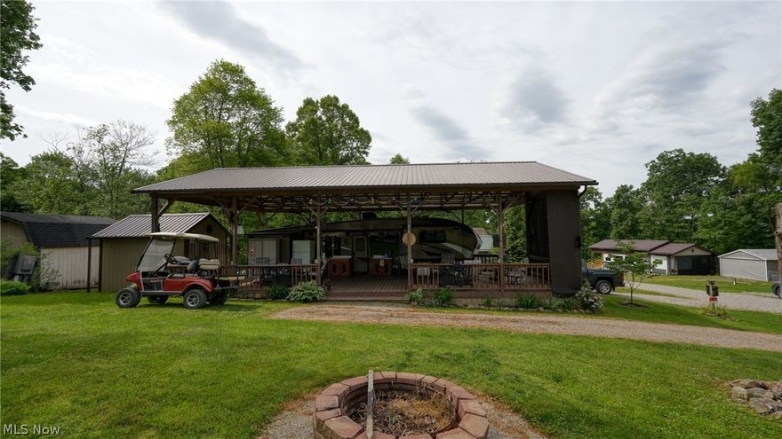 Exceptionally nice camp site located in Pikes Peak Campground. There is a 2015 Cougar Camper in great condition sitting on 2 lots (494-495) on Amarillo Lane, with an attached deck with a fantastic 30'x50' roof over all. There is so much covered area with many possibilities and comes furnished, including matching deck furniture. A new LG Refrigerator, Rubber maid cabinets, wood cabinets, a shed and other nice misc items. 
Included with this sweet place is a golf cart to take you to the pool or community room for many activities . There are personal touches that make this property very special.