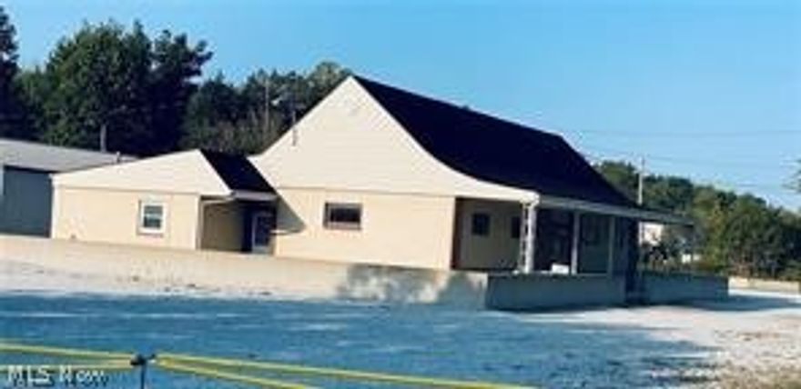 Great location for an office setting, spacious office building, 7-8 large offices w/conference room & 1.5 restrooms on main floor, no steps plus large garage/storage dock. Back workshop w/ bathroom, 16' garage door & sandblaster ready for use. All situated on an acre, large level parking lot with easy ingress & egress off US 40 between Cambridge & New Concord, 389’ of road frontage on major highway, railroad access along backside of property, I-70 on ramp is located just a half mile east of property.