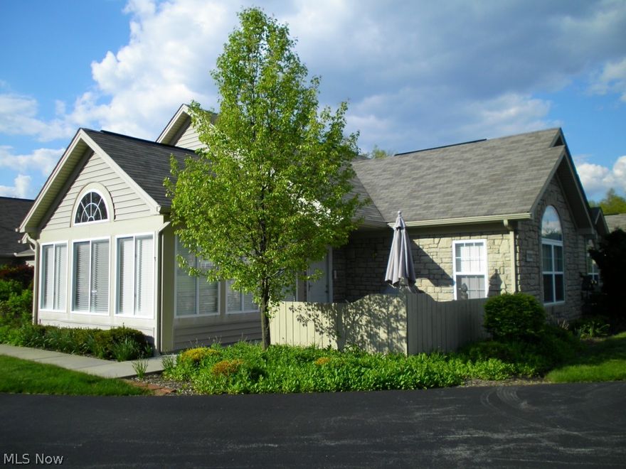 Beautiful ranch condo in Woodland Run Development in Columbiana.  This home feature a sunroom with an abundance of natural light.  Living room with gas fireplace. Open floor plan provides comfortable living with access  to dining area and kitchen.  Kitchen has breakfast bar, overhead lighting, pantry, all appliances.  Master bedroom includes private bath and walk in closet.  Second bedroom also features a private bath and walk in closet.  Laundry area near kitchen. 2 car attached garage.  Woodland Run Association also includes use of clubhouse, exercise room, pool.