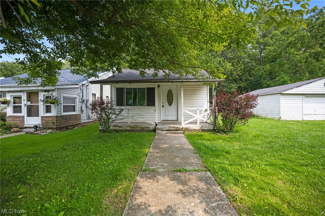 Perfect starter home or investment opportunity awaits by Lake Erie! The open kitchen features beautiful granite counter-tops. The dining room features a granite bar and cabinet space offering more storage. New water tank, refrigerator and washer June 2023. Relax on the quaint front porch or the large side deck. Very near to parks, shopping and medical facilities. Take your tour and make your offer today!