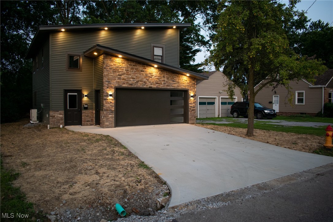 Welcome home to your dream modern style home! This stunning new 2-bedroom, 2-bathroom home offers the perfect blend of rustic charm and modern comfort. Thoughtfully designed with an open-concept layout, the main floor seamlessly connects the spacious kitchen and cozy living room—ideal for entertaining guests or relaxing with family. The kitchen is fully equipped with a dishwasher, microwave, and gas stove hookup, making meal prep a breeze. You'll also find a convenient half bath, a dedicated laundry area just inside the entryway, and built-in storage lockers to keep daily essentials organized. Upstairs features two generously sized bedrooms and a full bath, with additional space that could easily be converted into a third bedroom, home office, or flex area to suit your needs. Enjoy year-round comfort with in-floor heating throughout the home. The attached 20' x 22' garage offers secure parking and extra storage, while the large concrete driveway adds both function and curb appeal. Step outside to a spacious backyard complete with a beautiful concrete patio—perfect for outdoor dining, entertaining, or simply unwinding on warm summer evenings. Located on a quiet street in Perry Township and within the desirable Perry Local School District, this home offers peaceful living while still being just minutes from local amenities. Don’t miss your chance to own this unique and beautifully crafted home. Schedule your private tour today!
