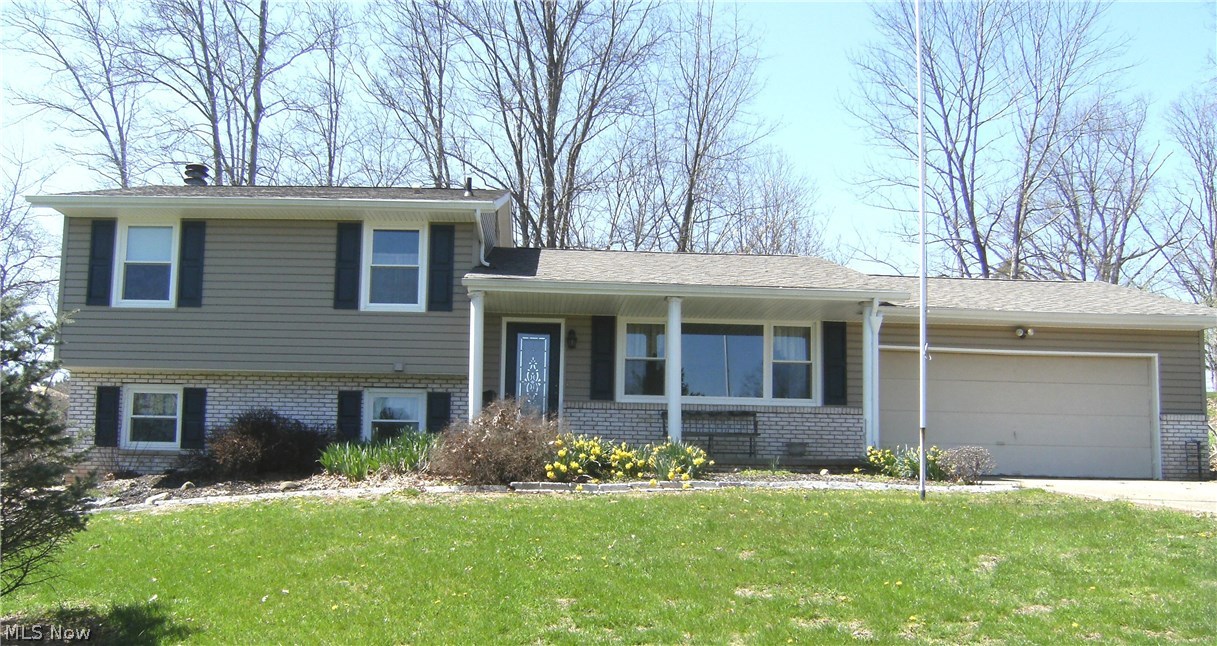 Located just 4.5 miles from the Seneca Lake Marina on 3.25 acres this quad level home on a secluded cul-de-sac has many updates. In 2016 the owner made the following investment; new tilt-in windows, a new roof, new gutters with gutter guard, a new deck and vinyl siding with 1.25 inch thick insulation for optimal energy efficiency. The first floor includes the living room, dining area and an updated kitchen. The two car garage is accessible from the kitchen which makes unloading groceries very convenient. Adjacent to the kitchen, the dining area features a French door leading to a private deck. A lower level has sun lit family room which features a brick fireplace with wood stove insert, and a walkout leading to a concrete patio and hot tub. This level also feature a fourth bedroom and a convenient half bath. The upper level has three bedrooms, with ample closet space and a full bath. The basement provides lots of space for the laundry area and storage. If you are looking for a home on