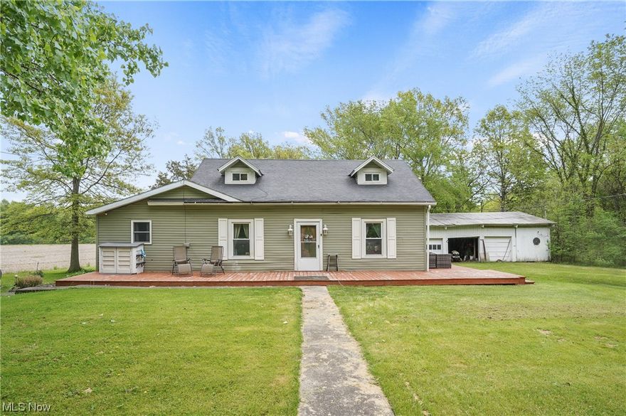 Postcard setting! Welcome to this charming three-bedroom, two full bath home sitting on 2.42 gorgeous acres! Come on in from the front deck and into the large living room offering fireplace with mantle, glass doors to the back deck where you can sit out and relax with your morning coffee. The dining room is open to the stunning kitchen which has a newer refrigerator and built-in microwave (2021), dishwasher, stove, abundant of cabinets, and ceiling fan. The laundry area is on the first floor. Master suite has a walk in closet and full bathroom. Upstairs there are two bedrooms and a full bathroom with newer sink. Outside you can enjoy a peaceful setting from the wrap around deck and there is plenty of area for those family gatherings etc. WOW! There is a three-car detached garage. Some updates include newer HWT, heater, siding and wrap around deck, poured concrete all within the last 5-7 years. Very convenient to Lake Erie, local wineries, marinas nearby and downtown.