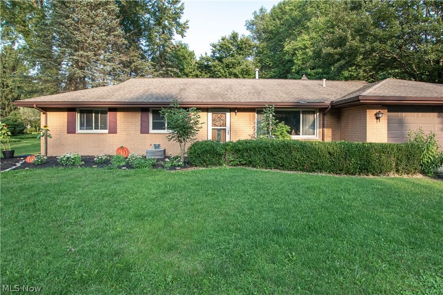 Welcome to 12999 Kenyon Drive! This charming brick ranch offers just over an acre of tranquil space, and several updates! Step inside to a bright living room, noticing hardwood floors that span most of the home. The eat-in kitchen offers a stainless refrigerator and dishwasher, an updated tile backsplash, and lots of storage space. Just off of the kitchen, a family room features a fireplace with brick surround, and lots of space to entertain and relax. A laundry room offers extra storage and a utility sink to keep things neat and organized. Down the hall, discover an owner’s suite with a private half bath, and two additional bedrooms sharing a full bathroom. Outside, enjoy the peace and quiet from the patio overlooking the backyard. Schedule your showing today!